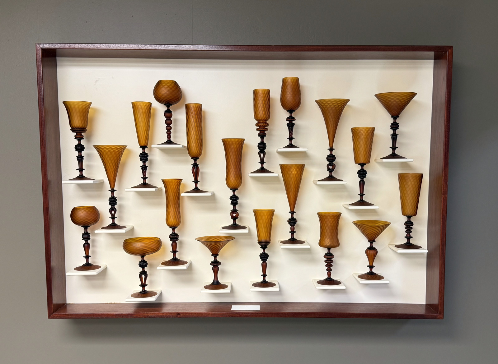 Hand-turned wooden goblets wall display